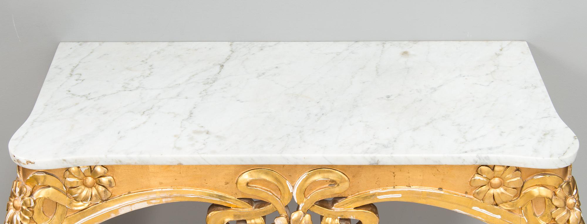 An Art Nouveau mirror with console table from early 20th century.