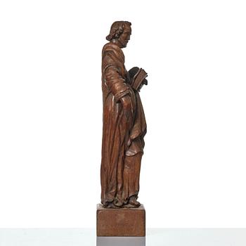 An oak sculpture of the apostle Luke, 18th/19th century.