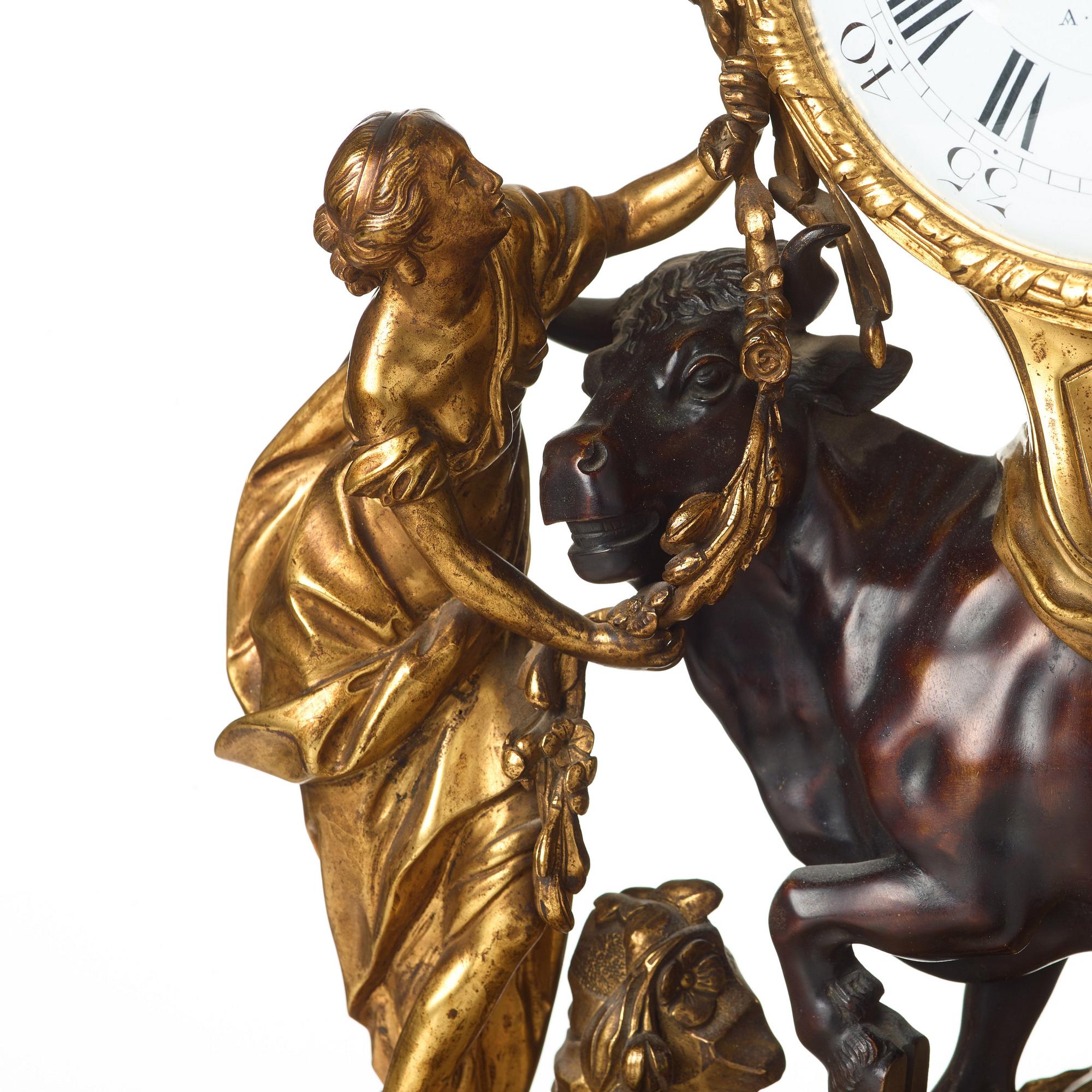 A Louis XV-style late 19th century mantel clock.