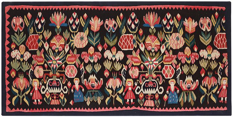 A carrige cushion, 'Urnor & par',  tapestry weave, c. 110 x 53 cm (with mounting 115 x 57 cm), circa 1800-1825.