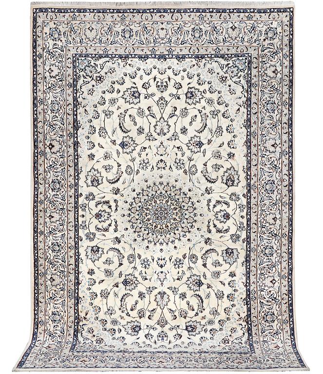 A Nain carpet, part silk, c. 294 x 193 cm.