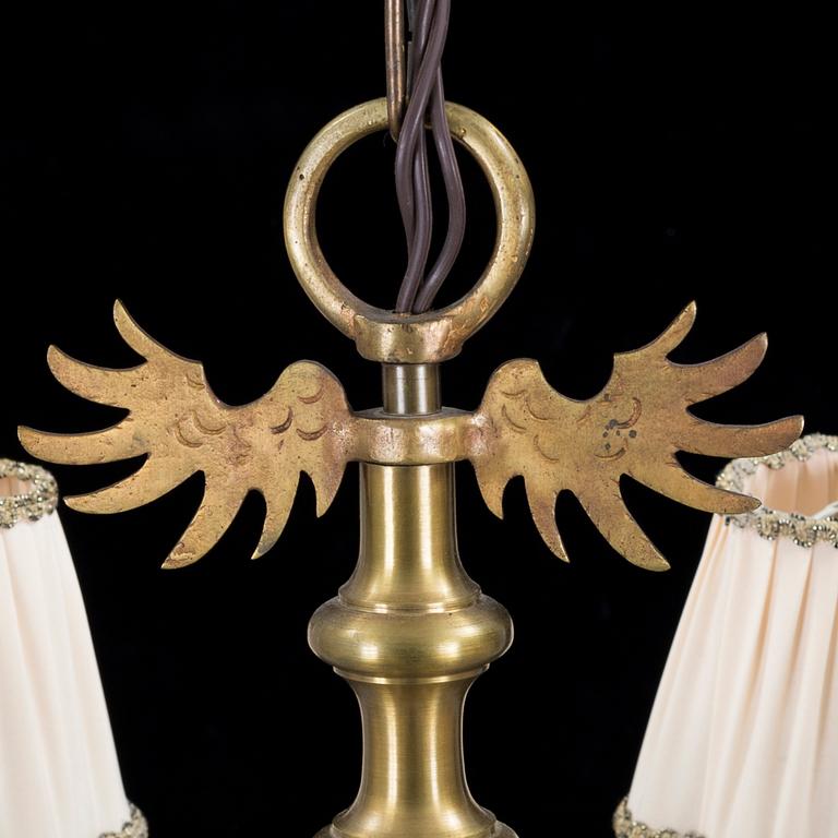 A 20th century baroque style brass ceiling light.