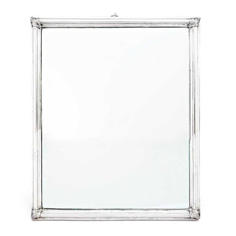 A probably mid-18th Century mirror with silver frame. Unmarked.