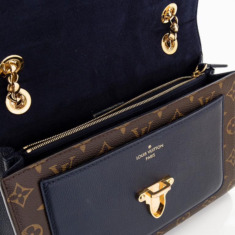 Louis Vuitton, a Monogram 'Victoire' bag.