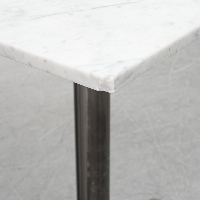 A marble top table, 21th century.