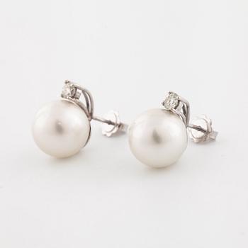 A pair of cultured pearl and old cut diamond earrings.