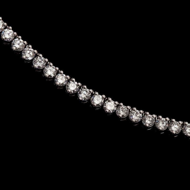 Kaulakoru, 18K valkokultaa ja briljanttihiottuja timantteja.