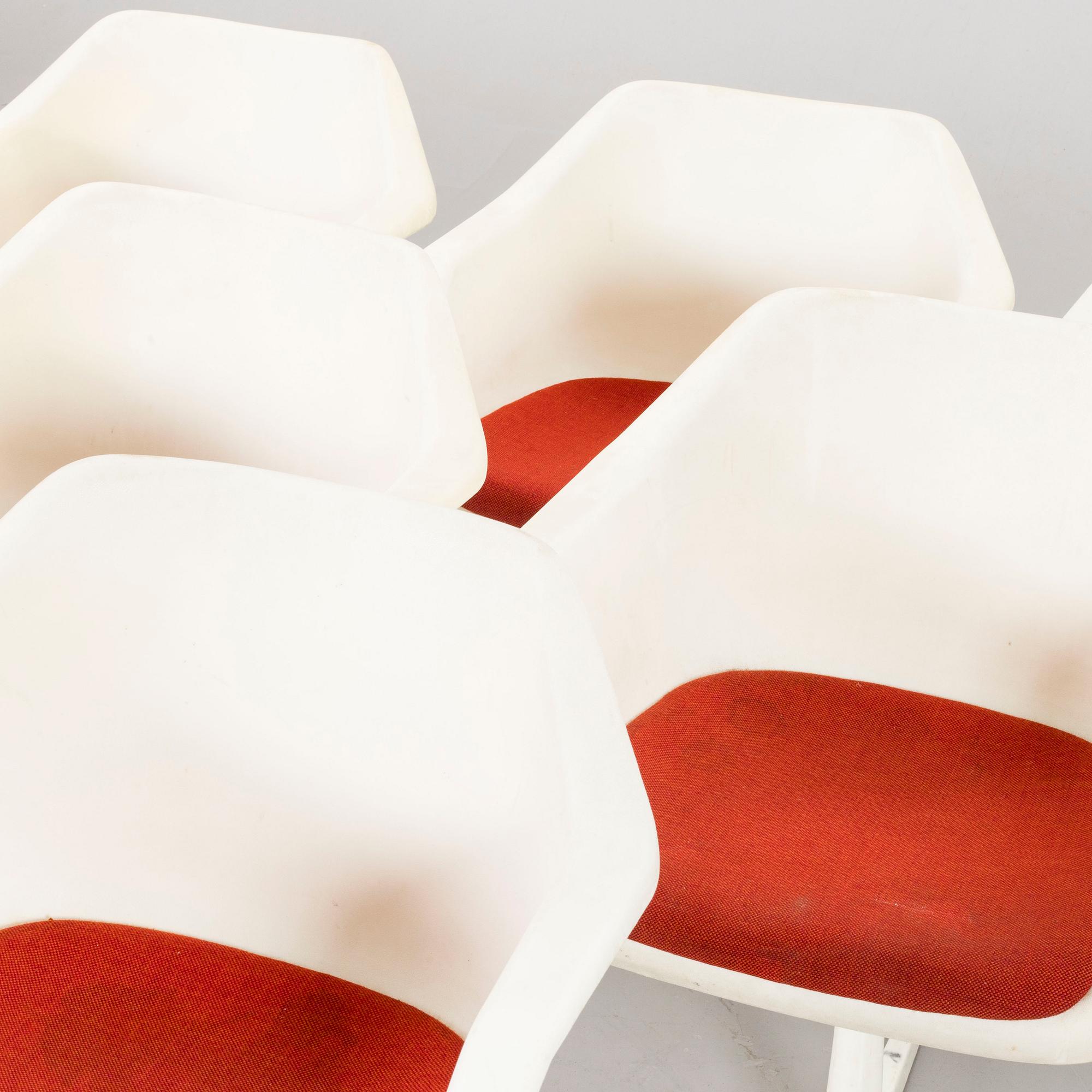 Six Robin Day armchairs.