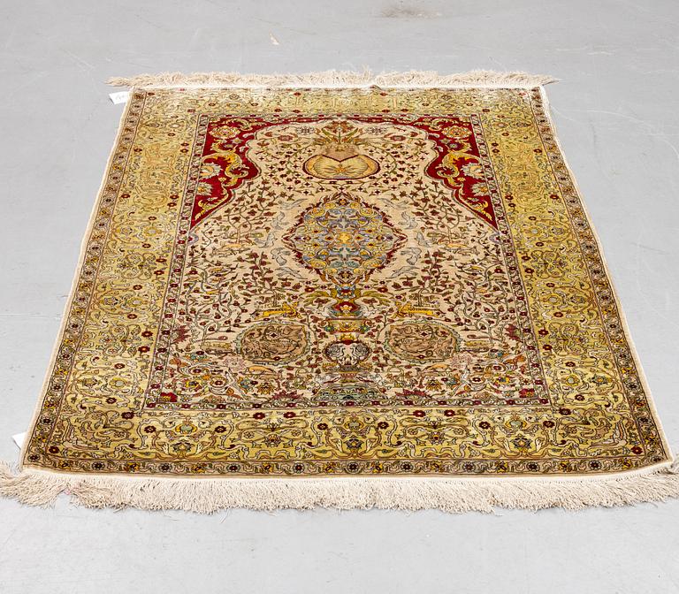 A rug, Old silk Hereke, ca 178 x 119 cm.