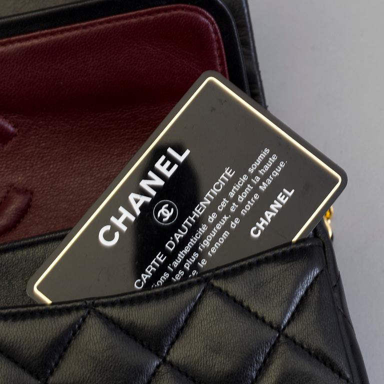 A 'Double Flap Bag' by Chanel, 1989-91.