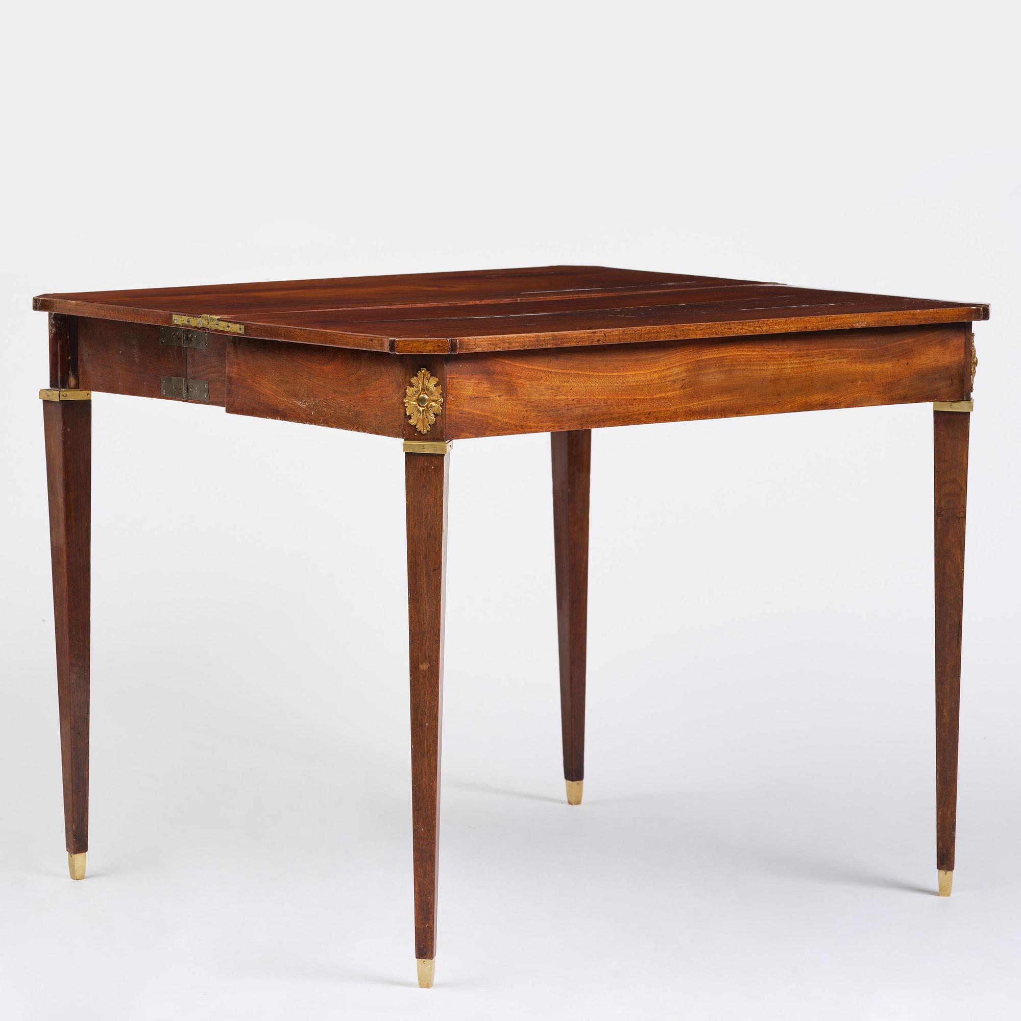 A Gustavian 'concertina action' mahogany games table by Georg Haupt (master in Stockholm 1770-84).