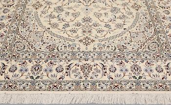 A Nain carpet, part silk, so-called 6LAA, approx. 301 x 198 cm.