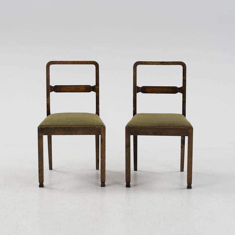 A Swedish Grace birch dining table and four chairs, 1920's/1930's.