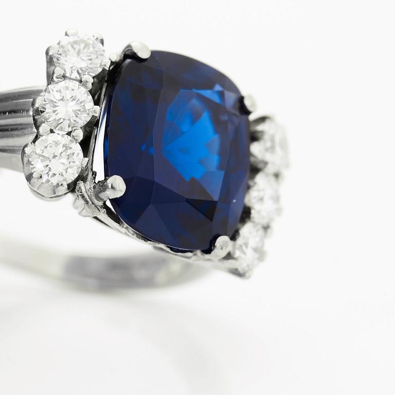 A RING set with a faceted sapphire.