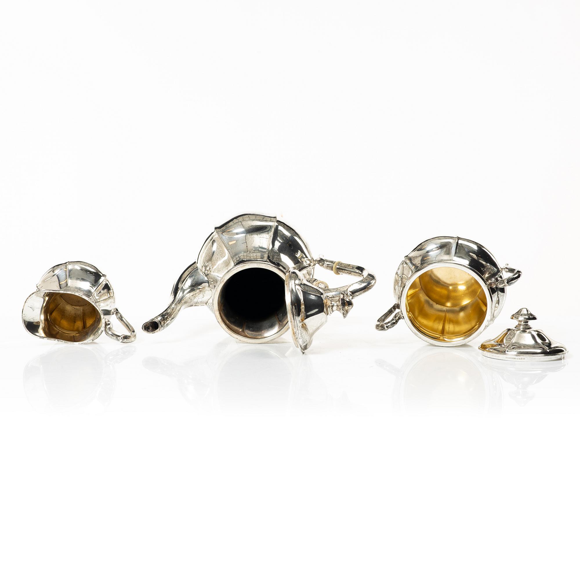 A silver coffee pot, cream jug and sugar bowl, Swedish import mark of CG Hallberg, Stockholm 1927.