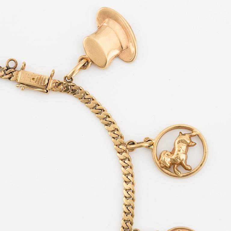Bracelet 18K gold with charms.