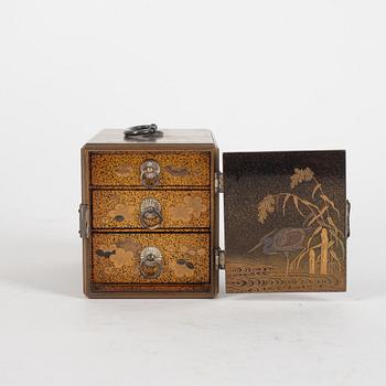 A Japanese lacquer box with three small drawers. Meiji.