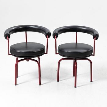 Charlotte Perriand, /Le Corbusier, swivel armchairs, a pair, model LC7, Cassina, Italy, latter half of the 20th century.