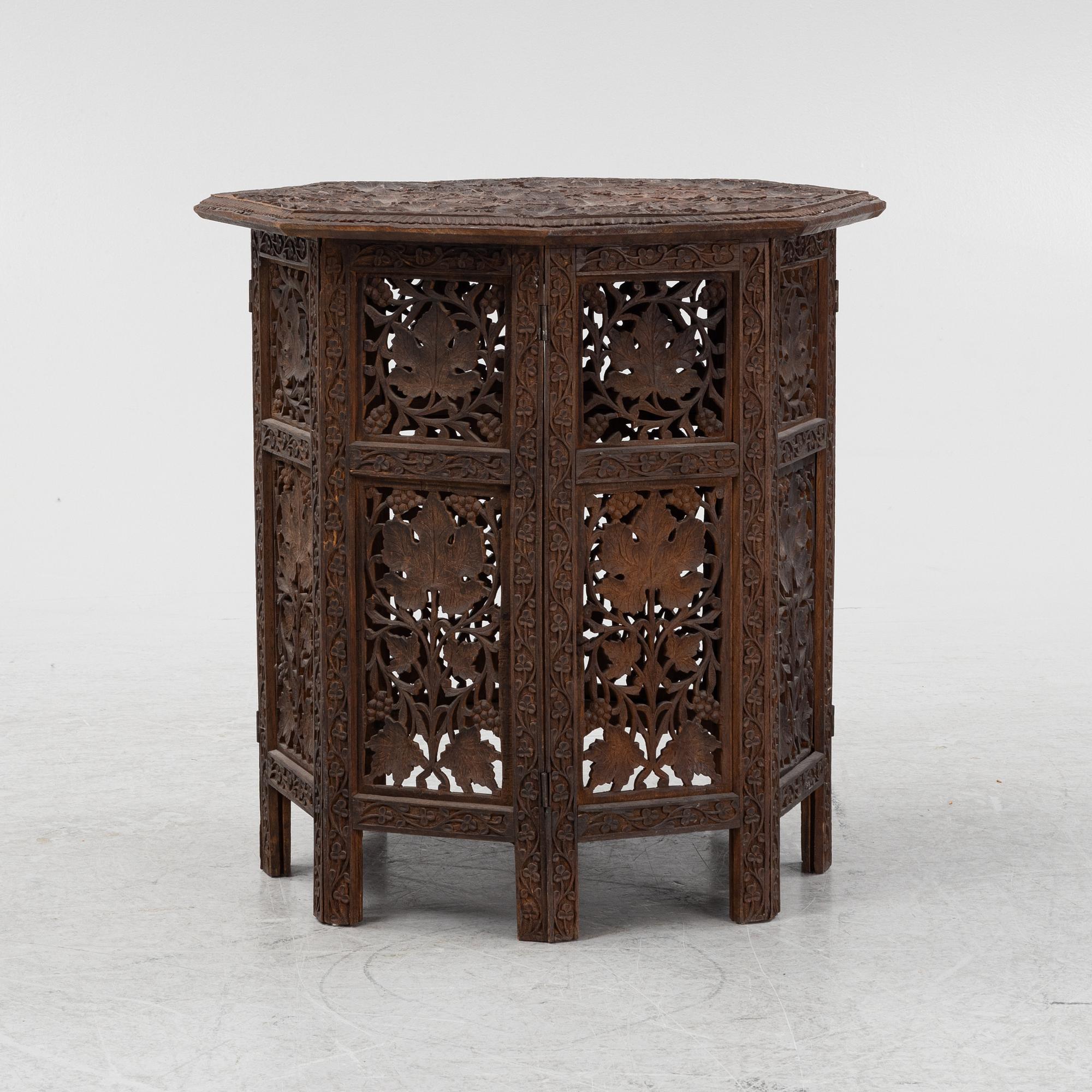 A carved table, first half of the 20th Century.