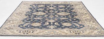An Agra carpet, c. 305 x 245 cm.