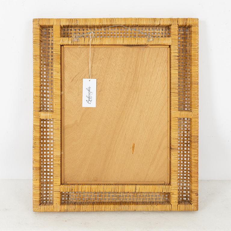 Rattan-covered frame.