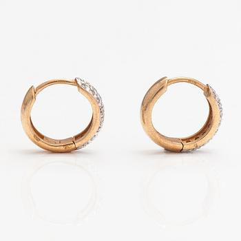 A pair of 14K gold earrings with diamonds ca. 0.30 ct in total.