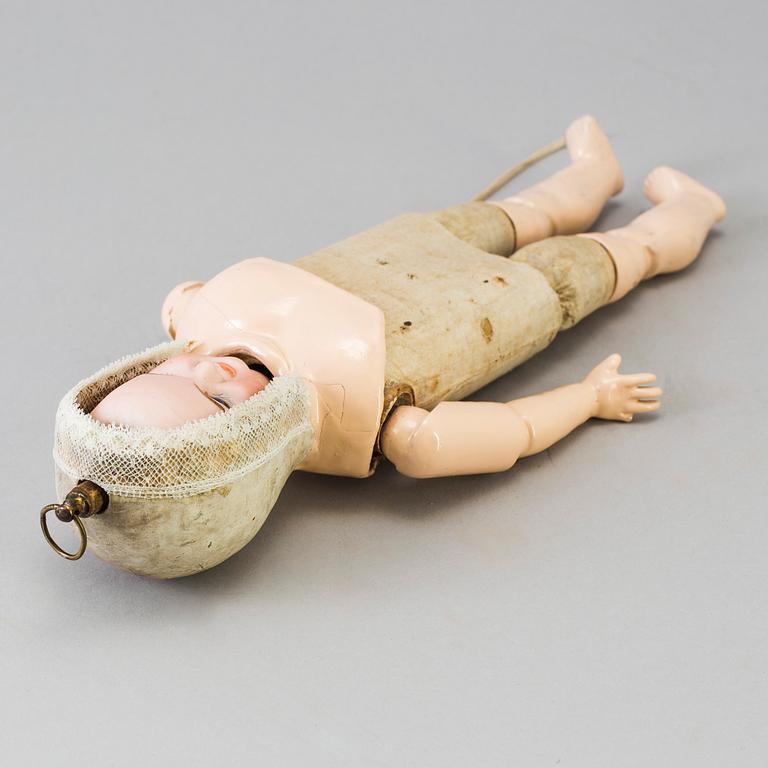 A bisque head multi-face doll, Germany, 1910s.