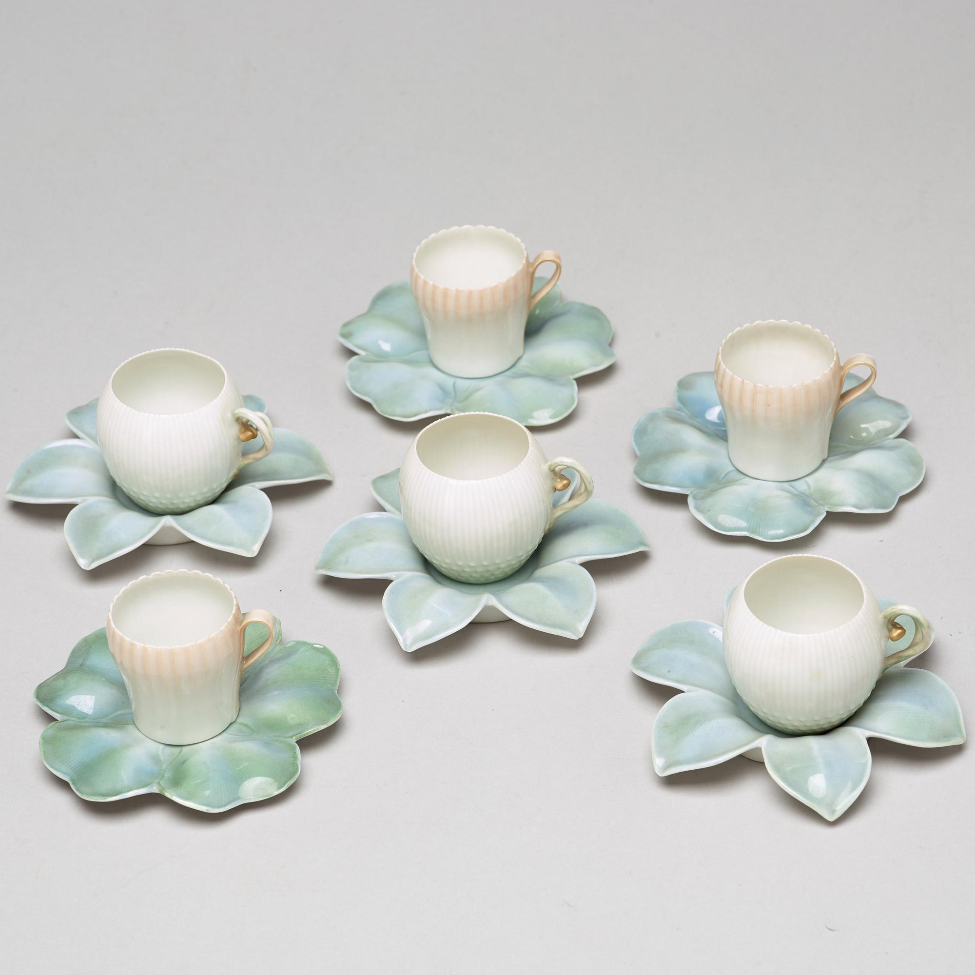 A set of six (3+3) cups with stands, Denmark, Bing & Gröndahl, early 20th Century.