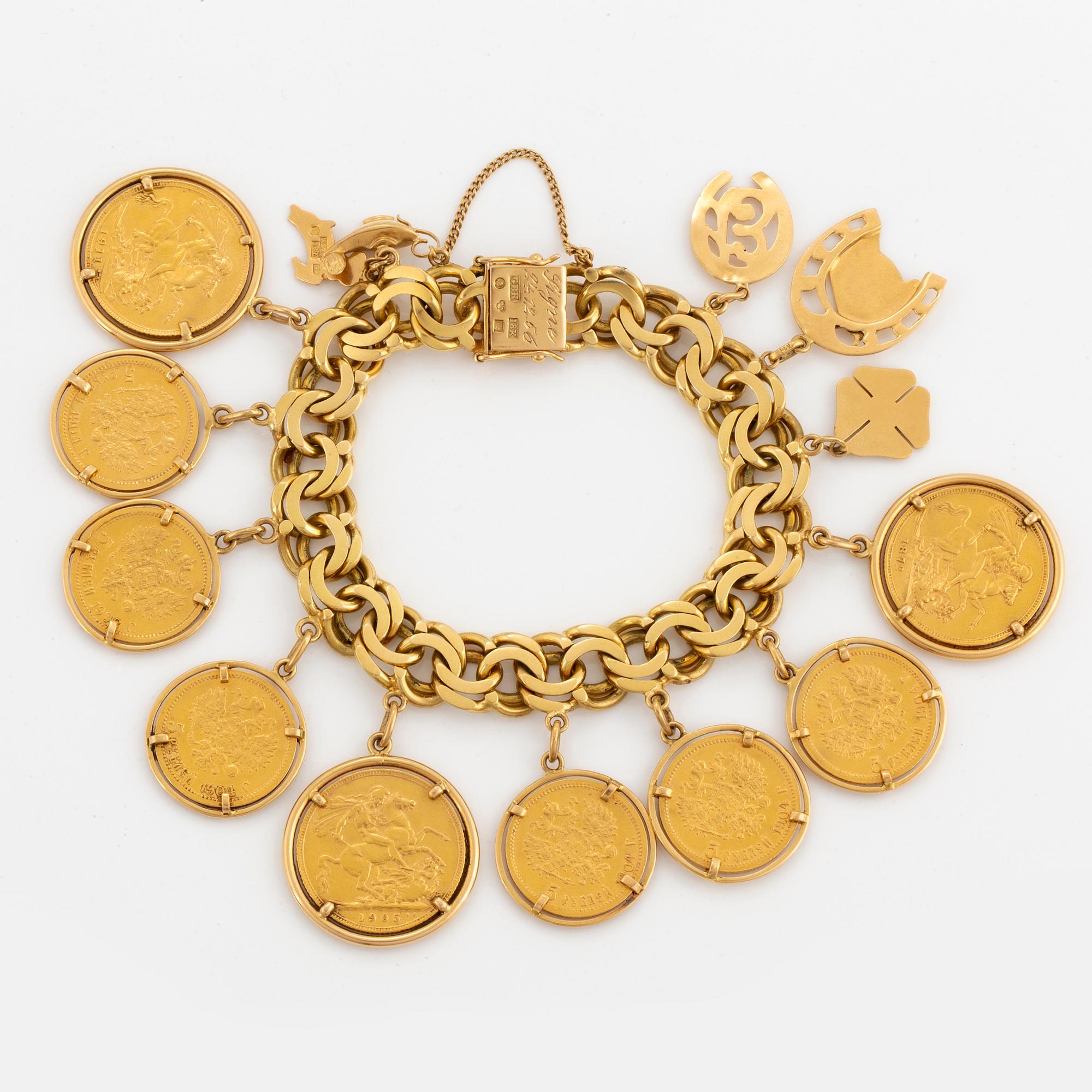 ARMBAND, 18K guld Bismarcklänk med berlocker och guldmynt.