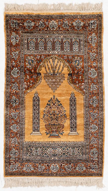 A silk Quum rug, c. 125 x 75 cm.