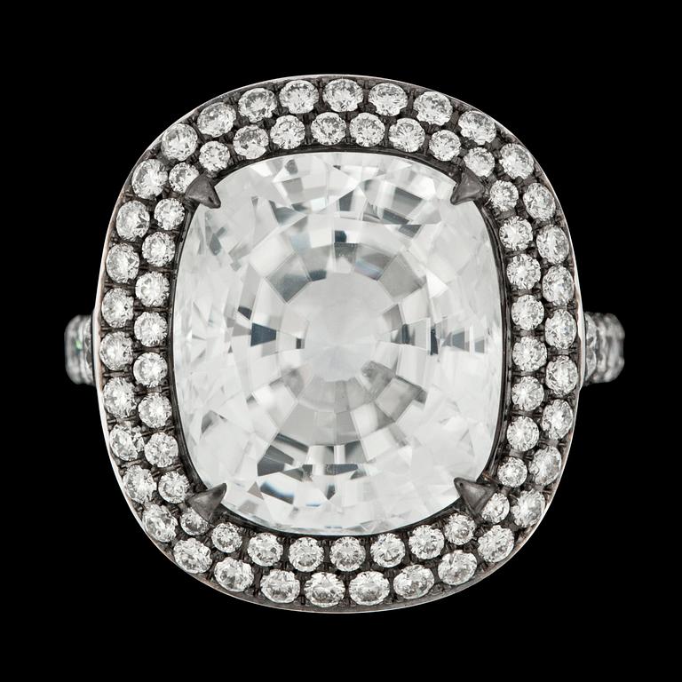 A large faceted white zircon, 16.09 cts,and brilliant cut diamond ring, tot. 1.64 ct.