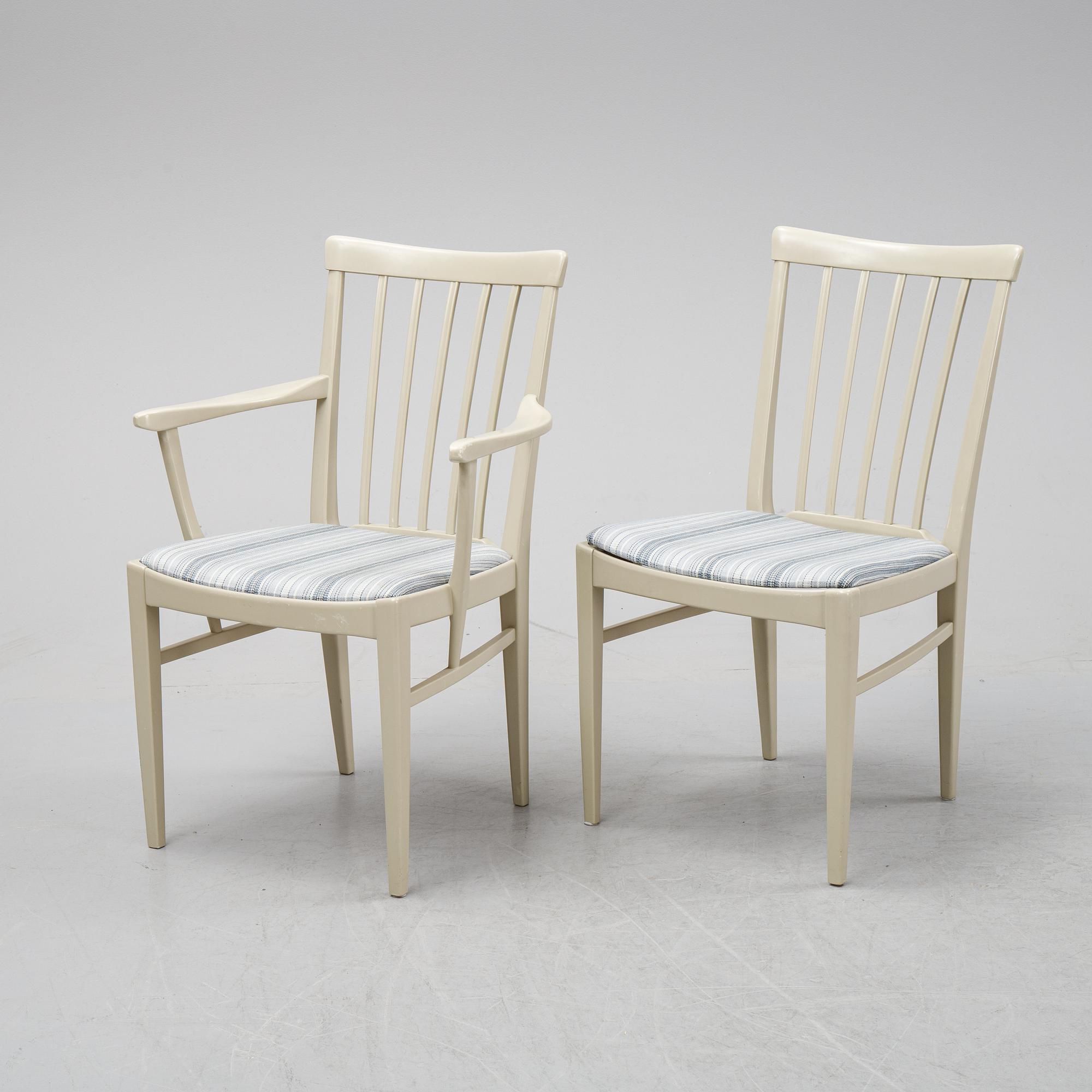 A dining table with two armchairs and six chairs by Carl Malmsten for Bodafors.