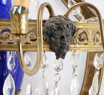 A pair of Russian Louis XVI-style  four-branch gilt bronze appliques, 19th century.