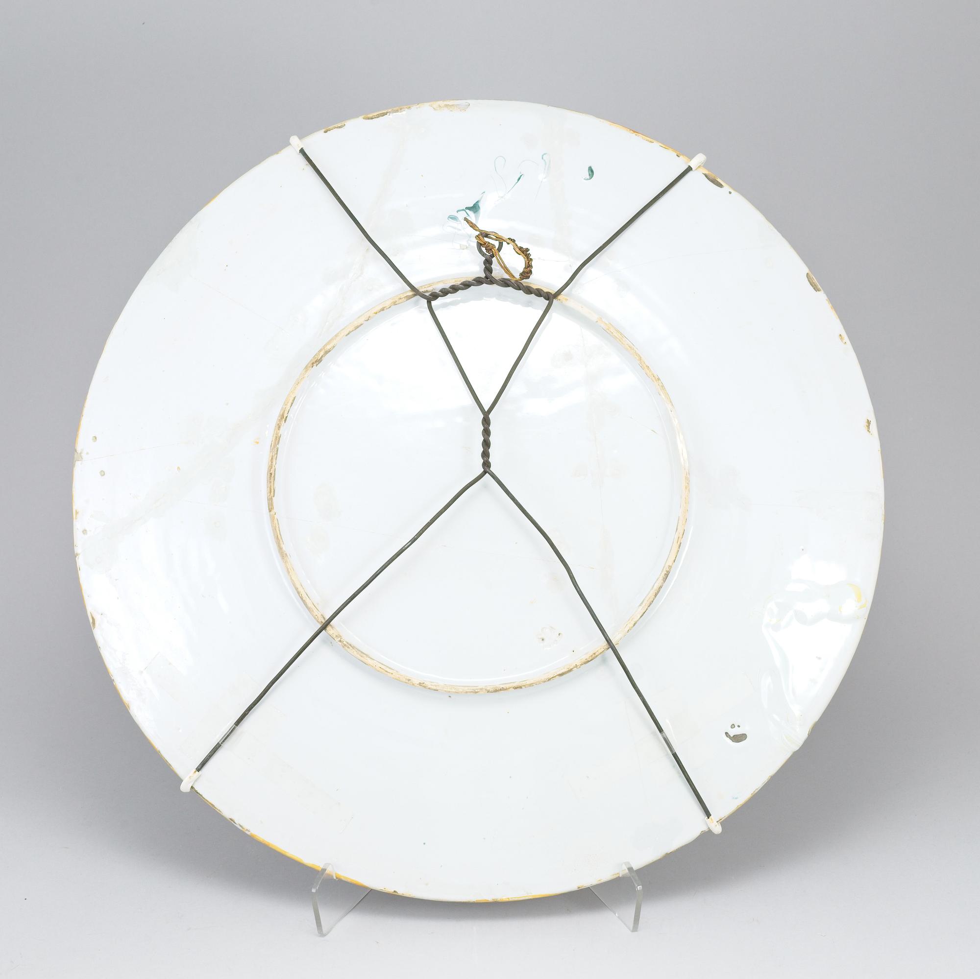 A large majolica 'istoriato' dish and two plates, 20th Century.