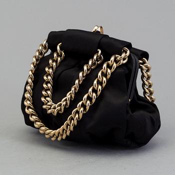 A black silk handbag by Christian Louboutin.