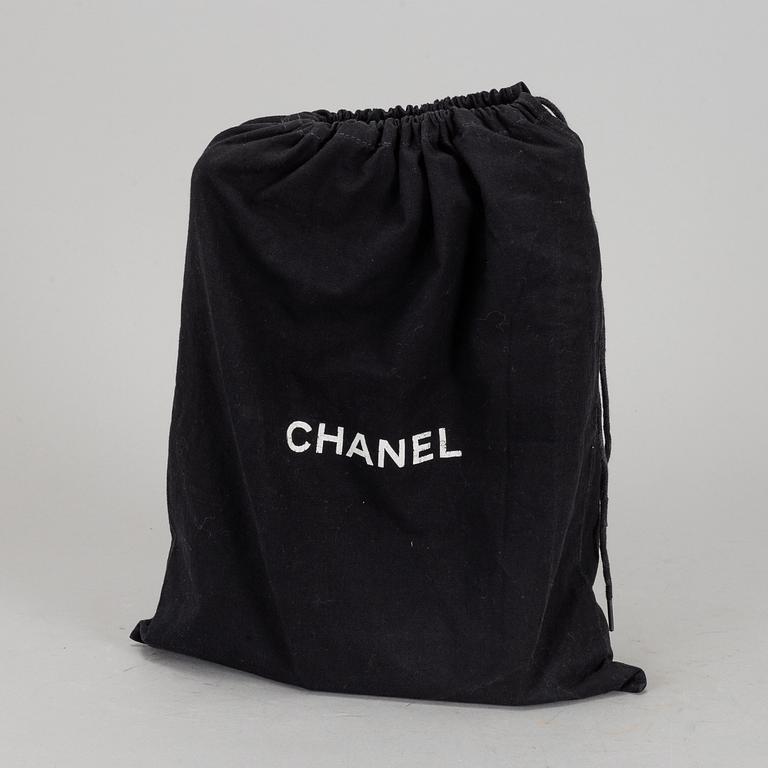 CHANEL, a quilted black leather 'Double Flap Bag'.