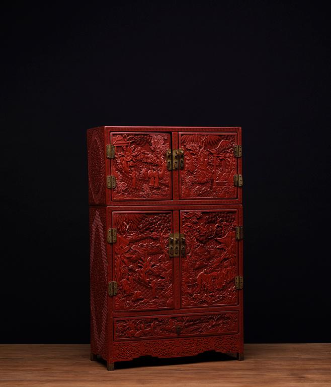 A carved  lacquer 'Kang'Cabinet, Qing dynasty, 18/19th Century.