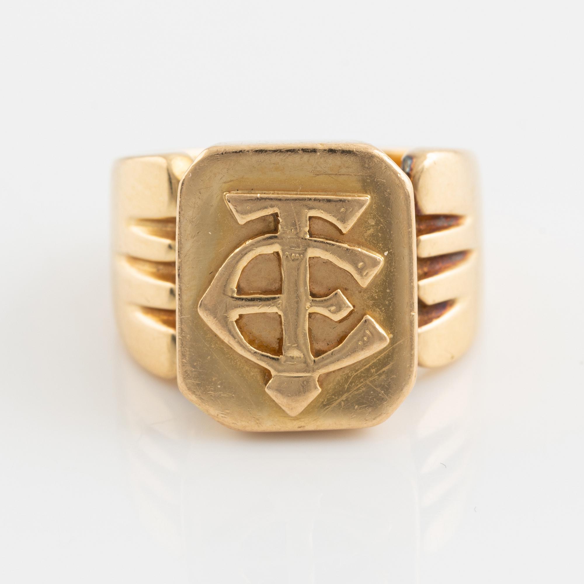 18K gold monograme ring.
