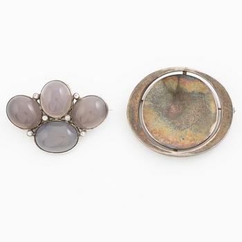 Two brooches, silver with chalcedony and white stones, SE Högberg, Gothenburg 1964 and H Strömdahl, Stockholm.