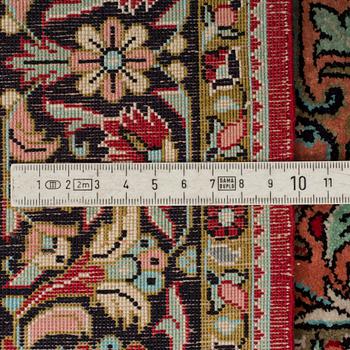 A silk Qum rug, around 114 x 80 cm.