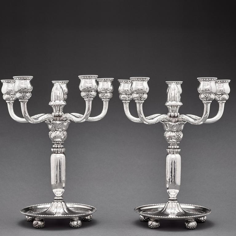 Georg Jensen, a pair of 830/1000 silver five light candelabra, Copenhagen 1920, design nr 200.
