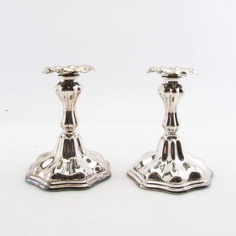 Candelabras a pair and candlesticks a pair Rococo style silver plate 20th century.