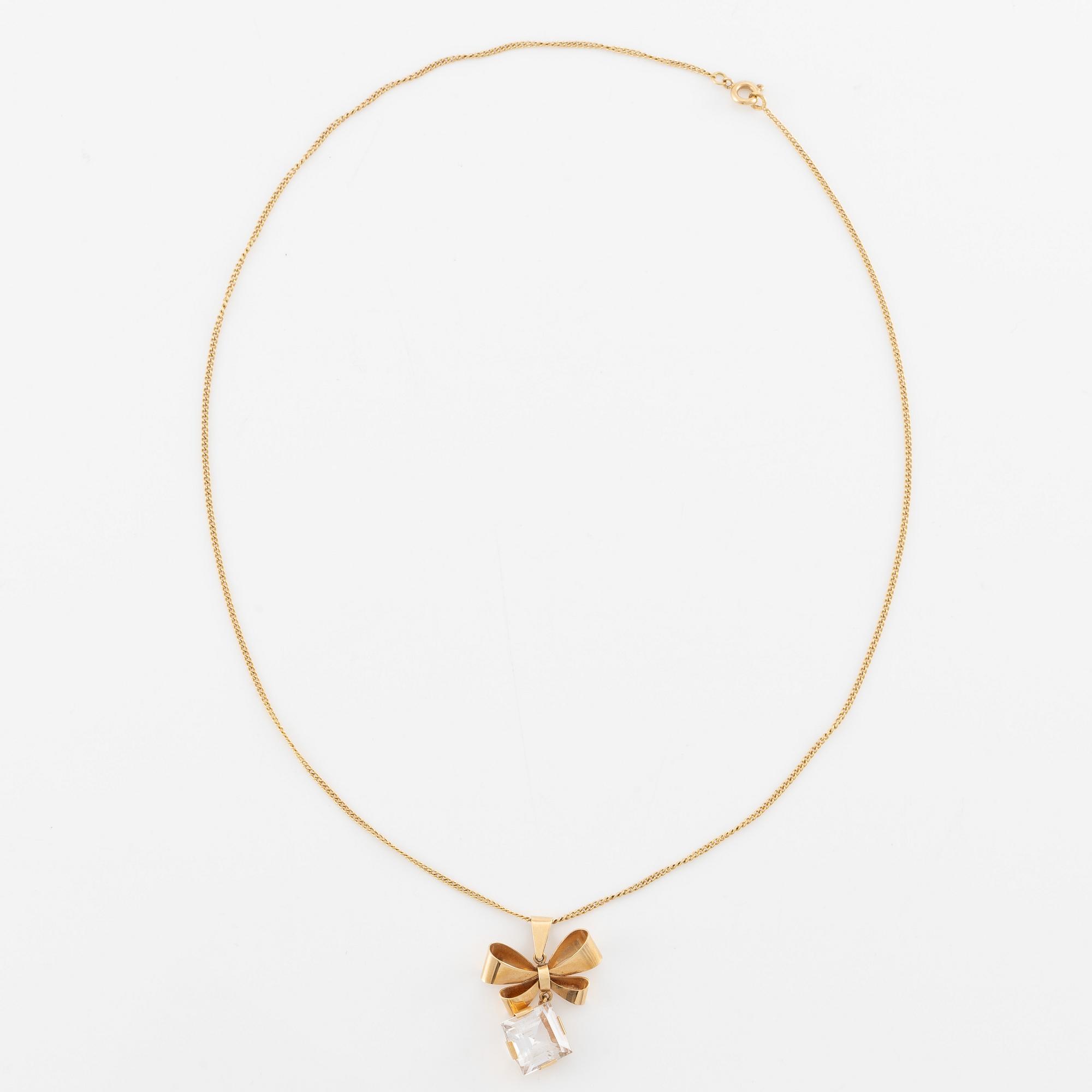 Necklace, 18K gold with synthetic white stone, in the shape of a bow.
