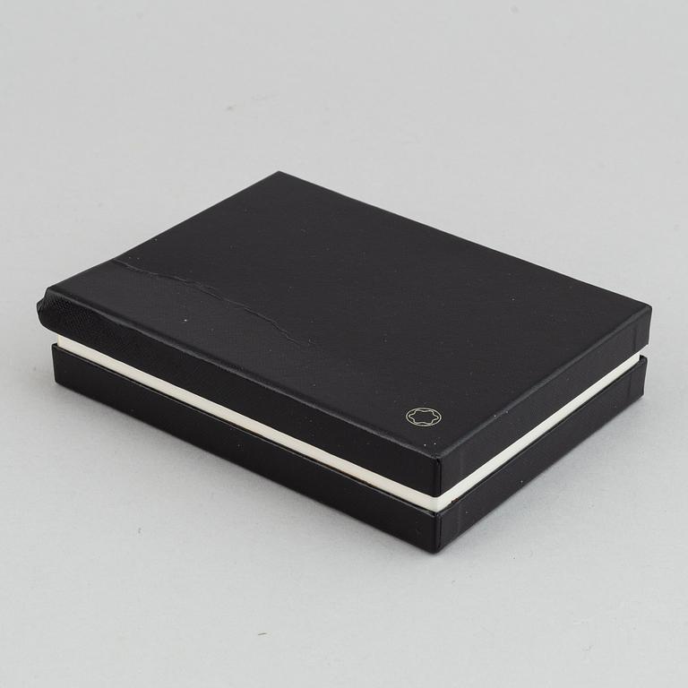 MOntblanc, a ball point pen and leather passport holder.