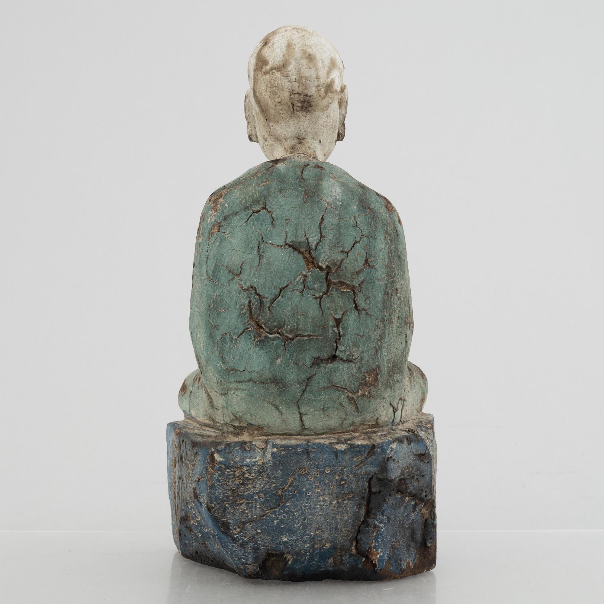 A Louhan, carved and painted wood, China, late Qing dynasty.