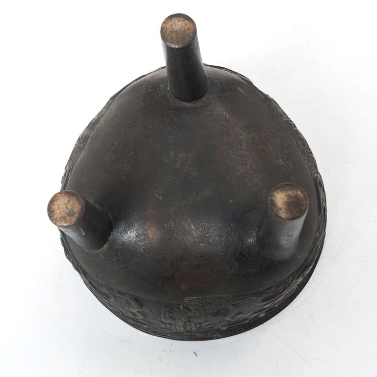 A Chinese tripod bronze censer, Ming style, Qing dynasty (1644-1912).