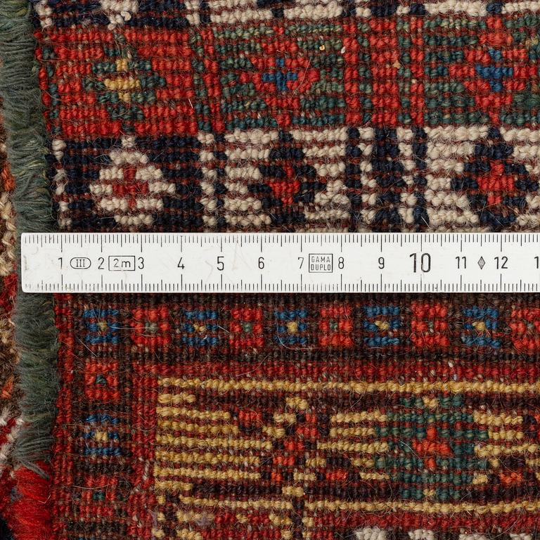 An antique Khamseh carpet, South western Iran, c 352 x 178 cm.