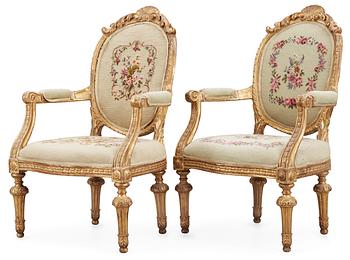 596. A pair of south European 19th century armchairs.