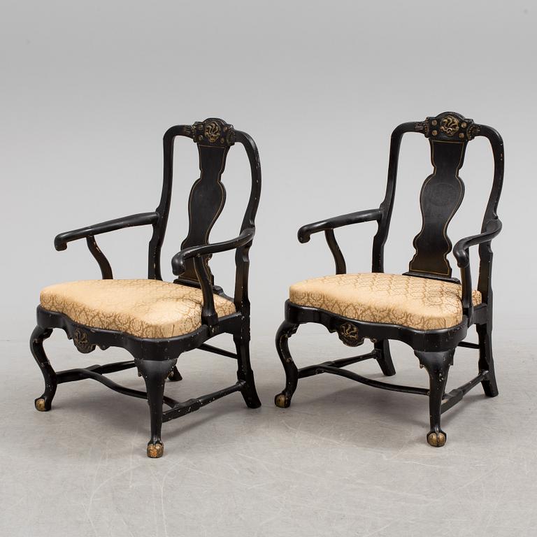 A pair of 18th century armchairs.