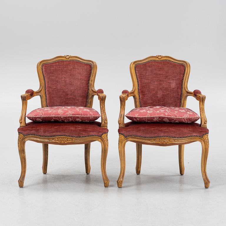 A pair of rococo style armchairs, 20th Century.
